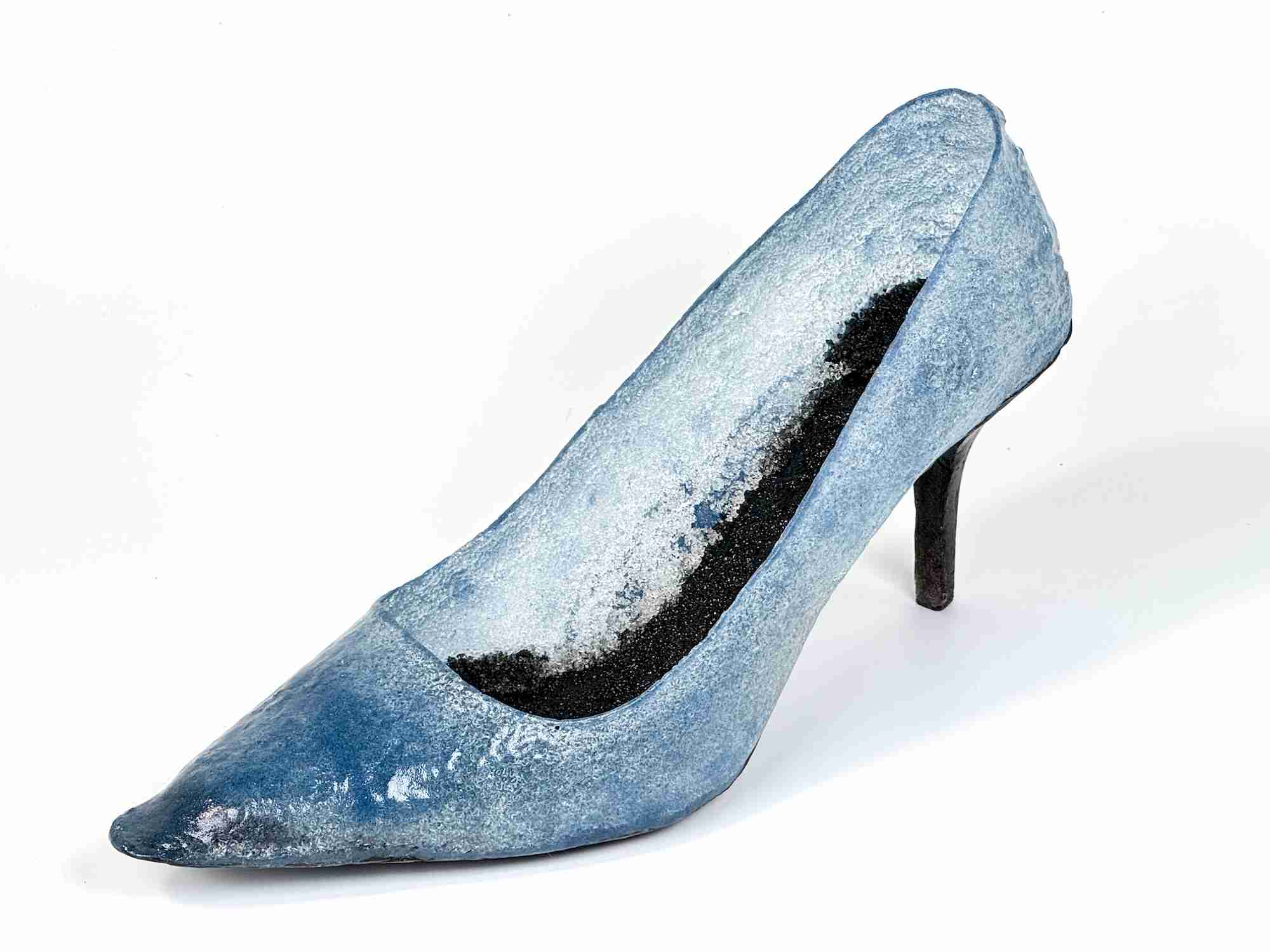 Blue glass shoe with a black heel